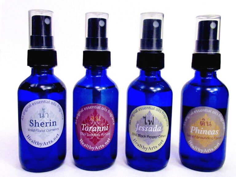 Vibrant blue essential oil bottles with colorful labels showcasing branding and packaging design.