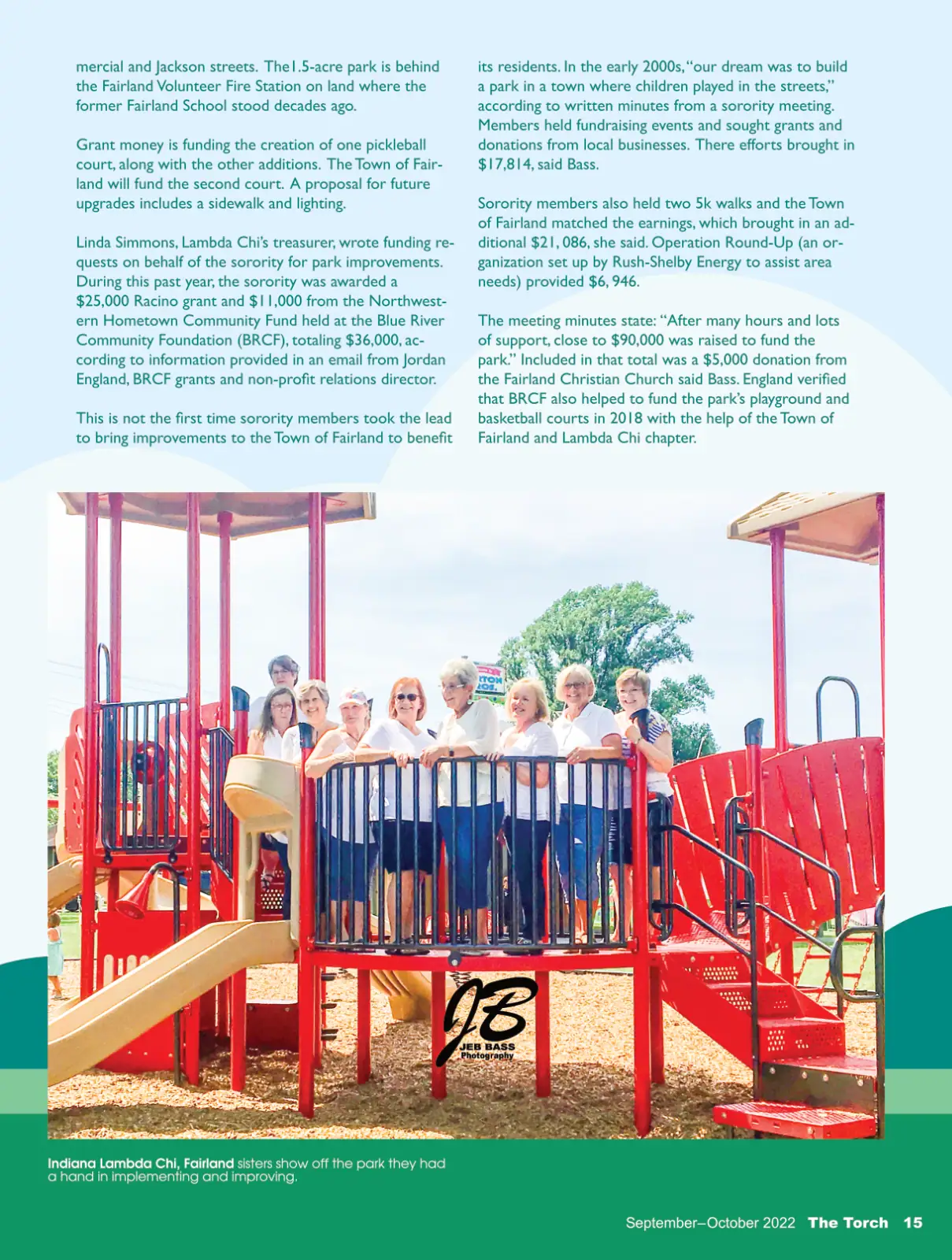 Children playing on a vibrant playground with safety barriers and climbing structures.