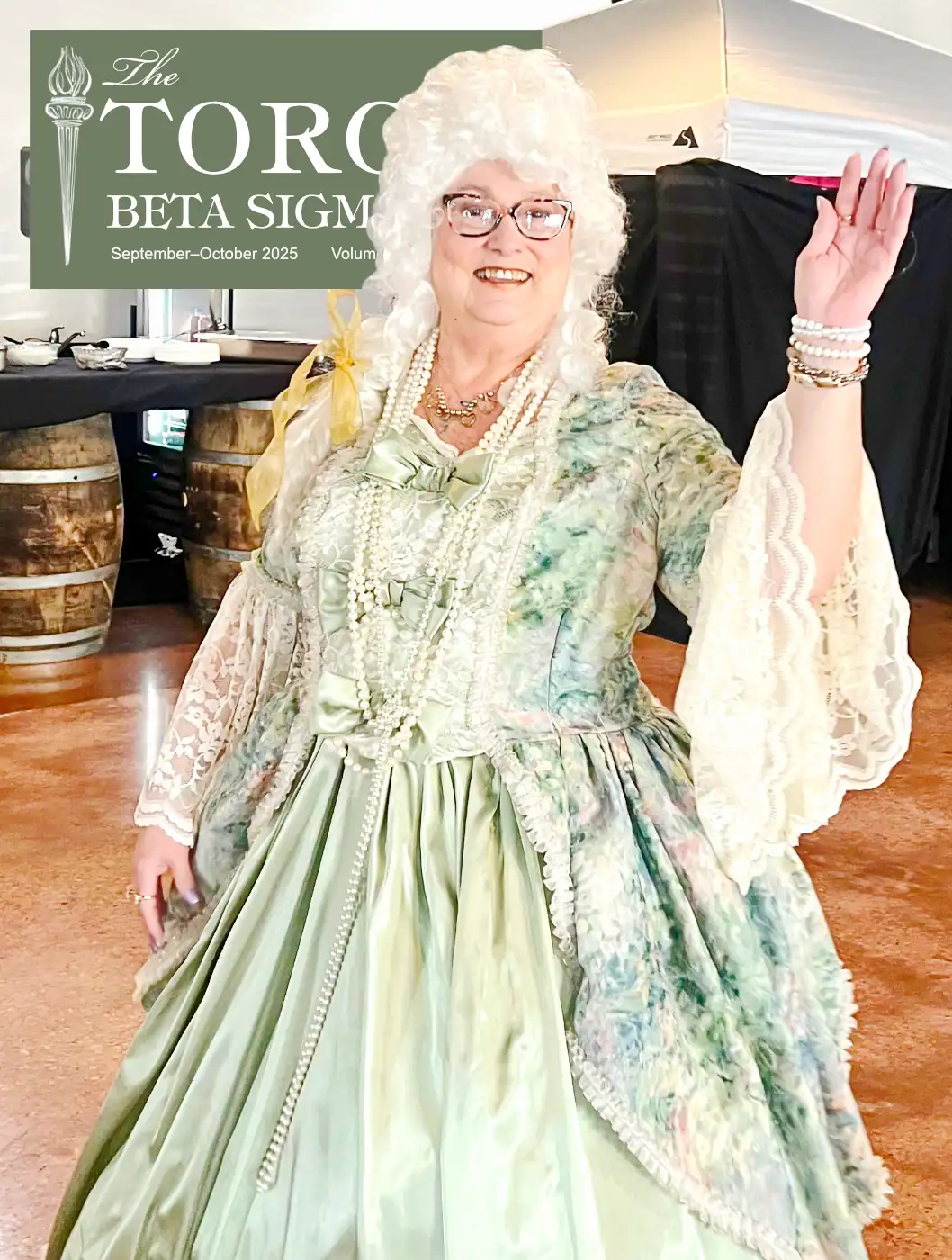 Cover design for a women’s organization magazine showing a woman in 18th-century-style green floral dress with high period hair, created as part of a full 30-page digital issue.