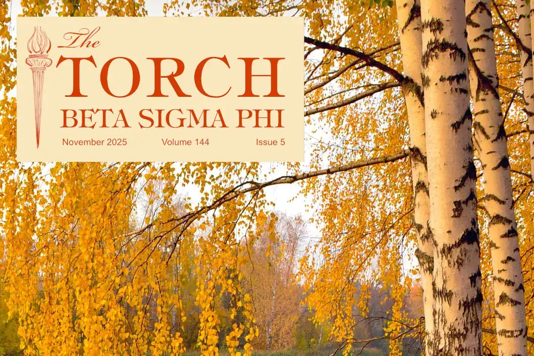 Vibrant autumnal forest with golden leaves and birch trees, seasonal nature scene.