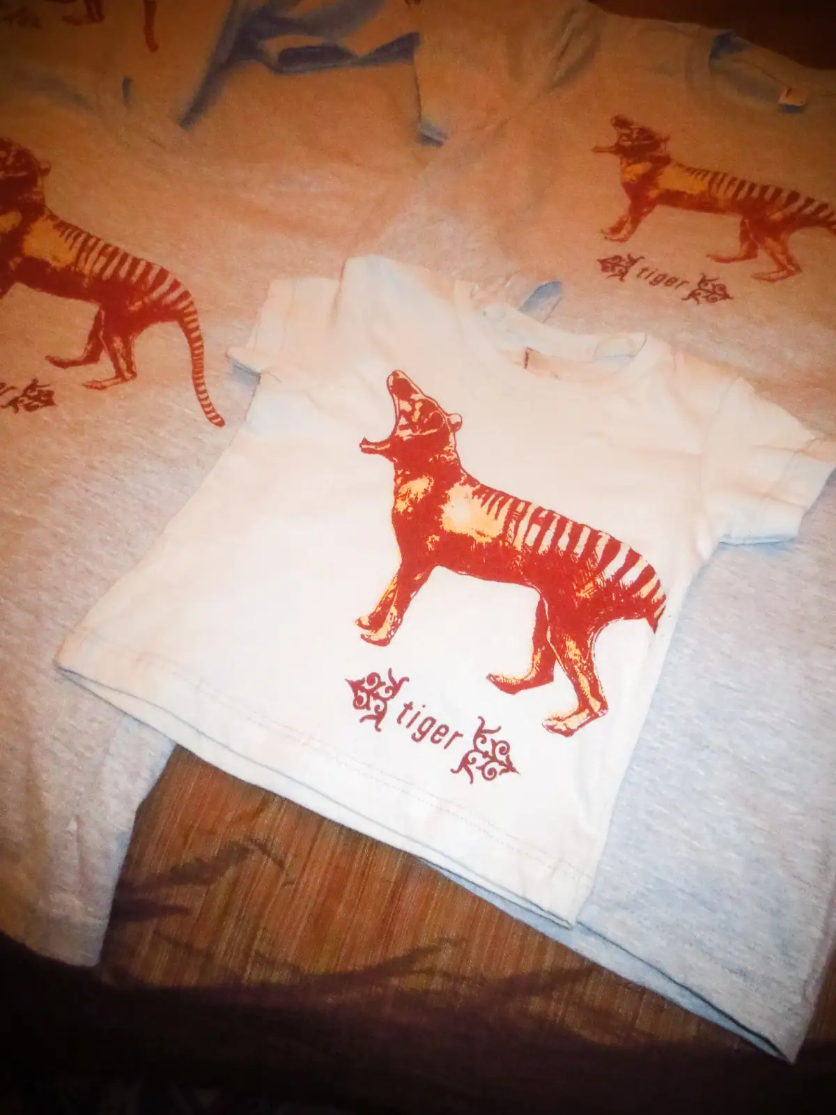Child's white t-shirt with a red tiger graphic and "my tiger" text.